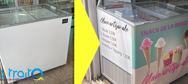 Impression découpe d'adhésifs habillage publicitaire vitrine à glace
